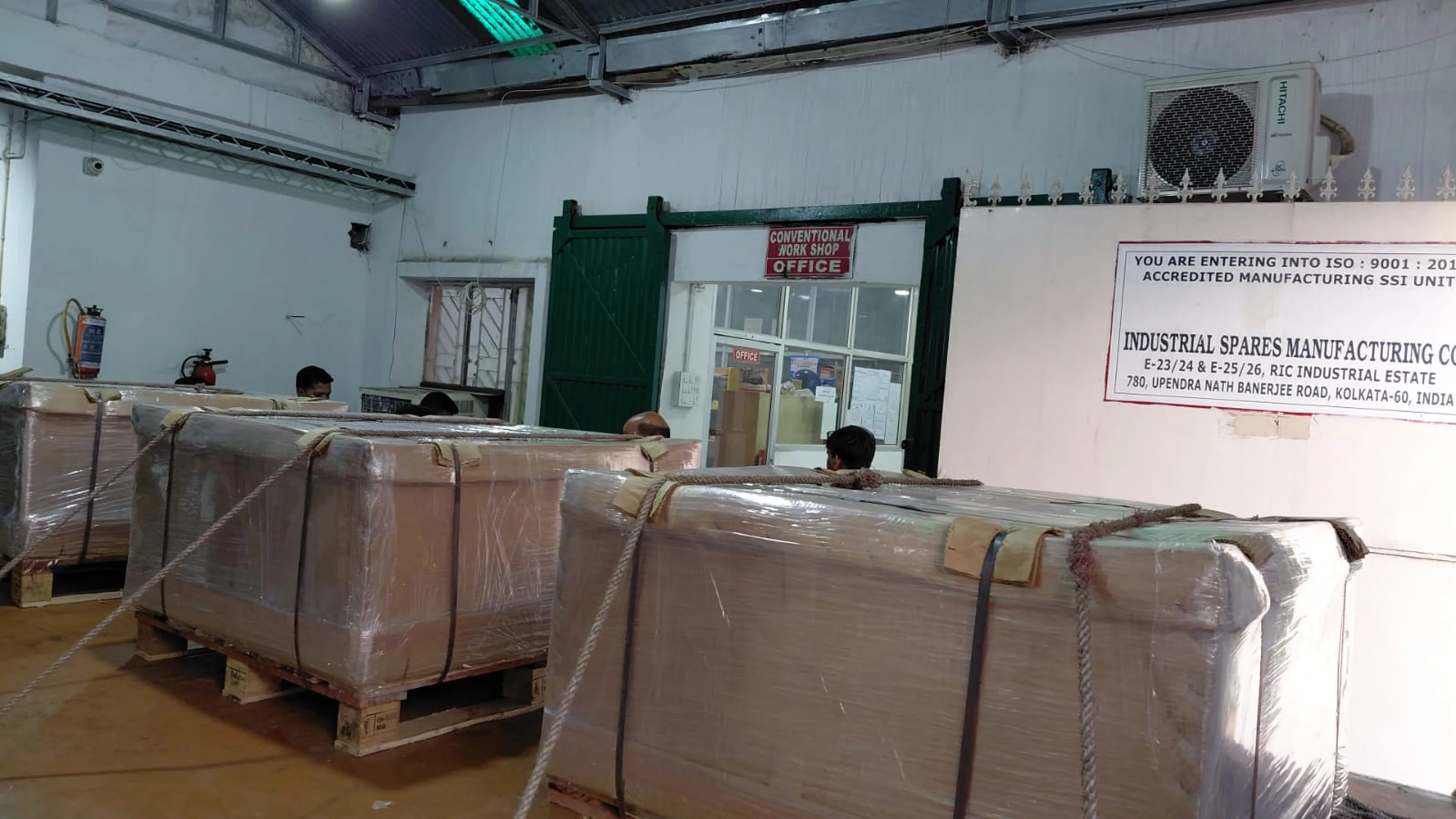 Export crates staged inside the workshop ahead of dispatch